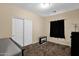 Cozy bedroom with neutral walls, carpet, and a closet with sliding doors at 2519 W Burgess Ln, Phoenix, AZ 85041
