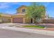 Beautiful two-story home with a brown garage door, desert landscaping, and a blue sky background at 2519 W Burgess Ln, Phoenix, AZ 85041