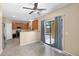 Kitchen with a sliding glass door to the backyard and features stainless steel appliances and warm lighting at 2519 W Burgess Ln, Phoenix, AZ 85041