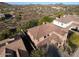 Desirable aerial view of a sprawling residence highlighting its expansive roofline, desert landscape, and mature landscaping at 26703 N 90Th Dr, Peoria, AZ 85383