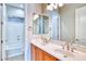 Bright bathroom with dual sinks and a tub/shower at 26703 N 90Th Dr, Peoria, AZ 85383