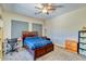 Comfortable bedroom featuring a ceiling fan, carpet flooring, and ample natural light at 26703 N 90Th Dr, Peoria, AZ 85383