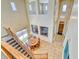 Open foyer offering high ceilings and a view of the dining room below at 26703 N 90Th Dr, Peoria, AZ 85383