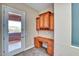 Home office featuring built-in cabinets and desk with access to the outside patio at 26703 N 90Th Dr, Peoria, AZ 85383