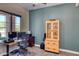 Cozy home office space with natural light, modern desk setup, and built-in storage at 26703 N 90Th Dr, Peoria, AZ 85383