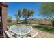 Inviting outdoor dining area with a stylish table and chairs, perfect for entertaining guests and enjoying al fresco meals at 26703 N 90Th Dr, Peoria, AZ 85383