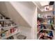 Walk-in pantry with shelving for ample storage of canned goods and food items at 26703 N 90Th Dr, Peoria, AZ 85383