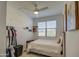 Inviting bedroom featuring a ceiling fan, storage, and comfortable decor at 2754 S Apache Dr, Chandler, AZ 85286