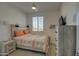 Cozy bedroom with a ceiling fan, window, and modern furnishings, ideal for relaxation at 2754 S Apache Dr, Chandler, AZ 85286
