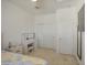 Well-lit bedroom featuring closet, vanity, neutral decor, and carpeted flooring at 2754 S Apache Dr, Chandler, AZ 85286