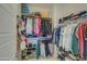 Spacious walk-in closet featuring clothing racks, shelves, and ample storage space for organization at 2754 S Apache Dr, Chandler, AZ 85286