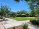 Community park area with a playground, lush green grass, and seating at 2754 S Apache Dr, Chandler, AZ 85286