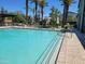 Community pool with plenty of seating, landscaping, and a covered lounge area, an idyllic spot for summer recreation at 2754 S Apache Dr, Chandler, AZ 85286