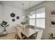Bright dining room features modern lighting, neutral walls, and decorative accents at 2754 S Apache Dr, Chandler, AZ 85286