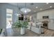 Open concept living room and kitchen, connected to dining room with modern wood table and pendant lights at 2754 S Apache Dr, Chandler, AZ 85286