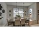 Bright dining room with contemporary pendant lights and view to the outdoor patio at 2754 S Apache Dr, Chandler, AZ 85286