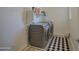 Well-equipped laundry room with modern washer and dryer, and storage shelves at 2754 S Apache Dr, Chandler, AZ 85286