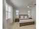 Bright main bedroom with ceiling fan, neutral carpet, and large windows at 2754 S Apache Dr, Chandler, AZ 85286