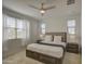 Comfortable main bedroom features a ceiling fan, plush carpet, and natural light at 2754 S Apache Dr, Chandler, AZ 85286