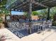 Well-appointed outdoor kitchen and dining area with a built-in grill and seating, great for entertaining and outdoor cooking at 2754 S Apache Dr, Chandler, AZ 85286