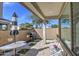 Covered patio featuring a dining set, grill, and lounge chairs, perfect for outdoor entertaining and relaxation at 2754 S Apache Dr, Chandler, AZ 85286