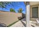 Side yard patio with pavers and a tall block wall, offering a private outdoor space at 2754 S Apache Dr, Chandler, AZ 85286