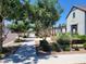 Landscaped street view with sidewalk, trees and shrubs leading to a modern community clubhouse at 2754 S Apache Dr, Chandler, AZ 85286
