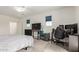 Open bedroom featuring carpet, a ceiling fan, window coverings, and desk area at 286 E Raleigh Dr, Chandler, AZ 85286