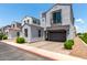 Charming gray two-story home with a two-car garage and beautifully landscaped front yard at 286 E Raleigh Dr, Chandler, AZ 85286