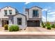 Charming gray two-story home with a two-car garage and beautifully landscaped front yard at 286 E Raleigh Dr, Chandler, AZ 85286