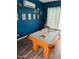 Game room with a classic pool table, stylish blue walls, and a vintage arcade game at 286 E Raleigh Dr, Chandler, AZ 85286