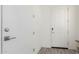 Bright hallway with wood-look flooring and a white front door with modern hardware at 286 E Raleigh Dr, Chandler, AZ 85286