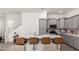 Modern kitchen featuring an island with seating and gray cabinets at 286 E Raleigh Dr, Chandler, AZ 85286