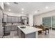 Modern kitchen featuring an island with seating and stainless steel appliances at 286 E Raleigh Dr, Chandler, AZ 85286