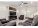 Cozy living room featuring plush seating, ceiling fan, and staircase access to the upper level at 286 E Raleigh Dr, Chandler, AZ 85286