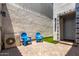 Charming outdoor patio with bright blue chairs and decorative tile details at 286 E Raleigh Dr, Chandler, AZ 85286