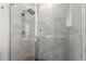 A close-up of a shower featuring stylish marble tiling and a glass door at 286 E Raleigh Dr, Chandler, AZ 85286