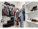 Organized walk-in closet featuring shelving and hanging rods for ample storage solutions at 286 E Raleigh Dr, Chandler, AZ 85286