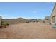 Spacious backyard area featuring gravel landscaping and a block fence for privacy at 30777 W Whitton Ave, Buckeye, AZ 85396