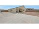 A spacious backyard featuring concrete and rock landscaping at 30777 W Whitton Ave, Buckeye, AZ 85396