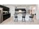 Eat-in kitchen with granite countertops, stainless steel appliances, and dark cabinets at 30777 W Whitton Ave, Buckeye, AZ 85396