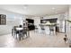 Spacious eat-in kitchen featuring dark cabinets, granite countertops and stainless steel appliances at 30777 W Whitton Ave, Buckeye, AZ 85396