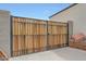 This property features a private side yard gate crafted from wood and steel at 30777 W Whitton Ave, Buckeye, AZ 85396