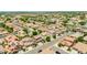 Aerial shot of a desert neighborhood with lush green landscaping, well-maintained lawns, and palm trees at 322 N 78Th Pl, Mesa, AZ 85207