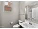 Neutral bathroom features a modern sink, toilet and mirror at 322 N 78Th Pl, Mesa, AZ 85207