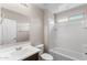 Clean bathroom with shower-tub combo, single sink vanity, and neutral tile at 322 N 78Th Pl, Mesa, AZ 85207