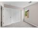 Bedroom features a closet with sliding doors and a bright window view at 322 N 78Th Pl, Mesa, AZ 85207