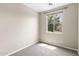 Bright bedroom featuring neutral carpet, natural light, and a closet at 322 N 78Th Pl, Mesa, AZ 85207