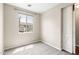 Bright bedroom featuring a window view and a barn door for added character at 322 N 78Th Pl, Mesa, AZ 85207