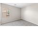 Bright bedroom features a neutral color palette with a large window at 322 N 78Th Pl, Mesa, AZ 85207